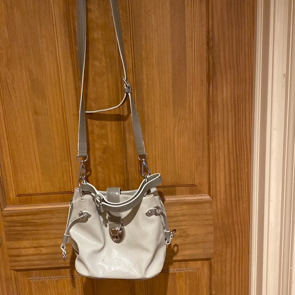 Tumi Handbags - Tumi   Luxe key lock beautiful crossbody with key. See pictures Mcmlxxv